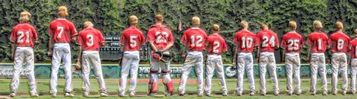 high school baseball team lined up for national anthem